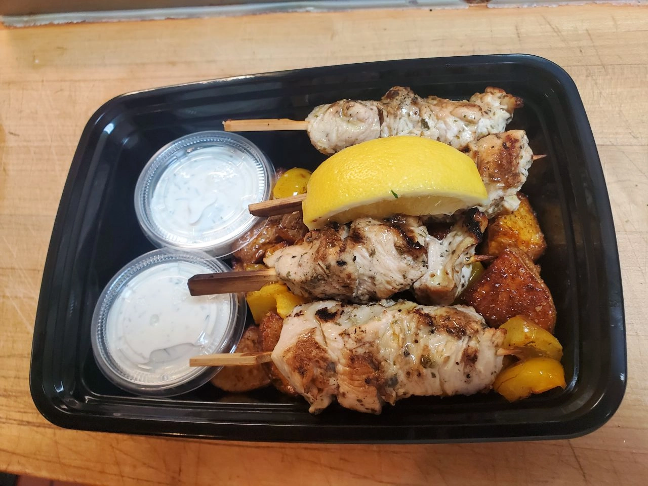 baconwrapped-chicken-thighs-with-herbed-quinoa-roasted-pineapple-and-mini-peppers